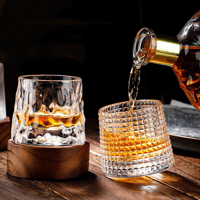 Rotating tumbler whiskey glass