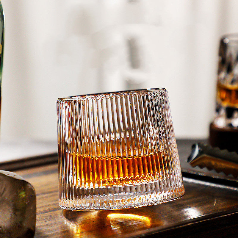 Rotating tumbler whiskey glass