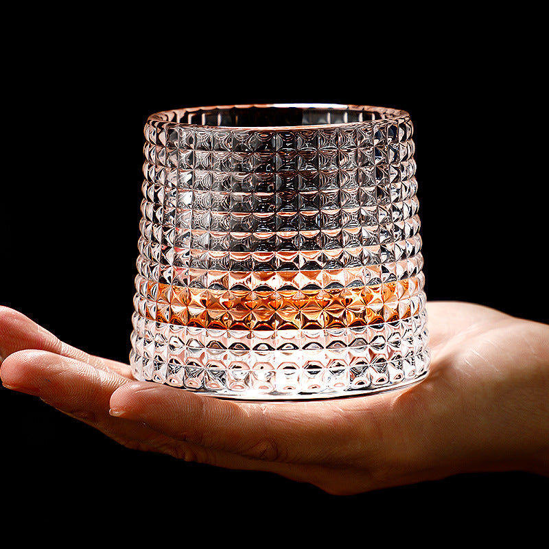 Rotating tumbler whiskey glass