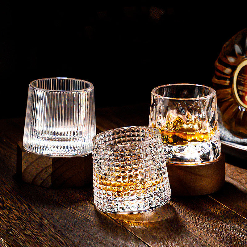 Rotating tumbler whiskey glass